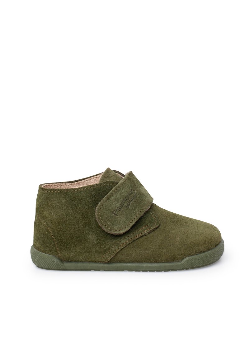 Green suede ankle boot with a Velcro strap, textured surface, rounded toe, and a flexible rubber sole for comfort and ease of movement.