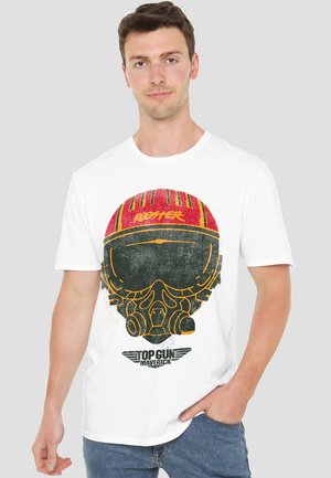 White cotton t-shirt featuring a graphic of a pilot's helmet with a red visor, vintage-style lettering, and "Top Gun Maverick" text at the bottom.
