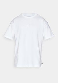 White cotton t-shirt with short sleeves, crew neck, and small white Nike logo on the chest. Simple design with a straight fit.