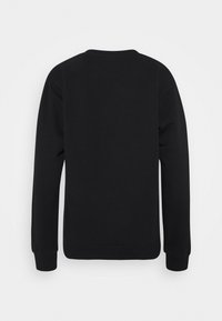 Sweatshirt noir avec un col rond, des manches longues et des poignets côtelés. Texture lisse sans motifs ni logos visibles au dos.