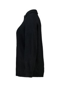 Zwarte, geribbelde gebreide trui met een kraag en lange mouwen. De textuur is zacht en enigszins grof, wat warmte en comfort biedt.