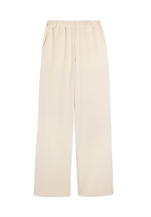Wide-leg pants in a light beige color, made from a soft fabric, featuring an elastic waistband and side pockets for functionality.
