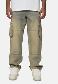 Luźne dżinsy cargo w jasnoniebieskim denimu, z dwoma bocznymi kieszeniami, przeszywaną fakturą, prostym krojem nogawek i z mankietami.