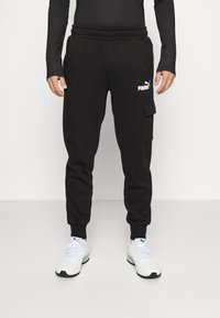 Puma CARGO PANTS - Pantalones deportivos - schwarz