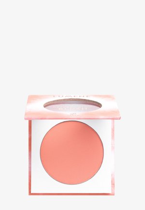 Kompakt mit korallenfarbenem mattem Rouge-Puder und einem pink marmorierten Deckel mit transparentem Fenster, das den Produktnamen zeigt.