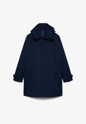 Manteau long bleu marine avec col, deux poches avant, sangles aux poignets et capuche sur fond blanc.