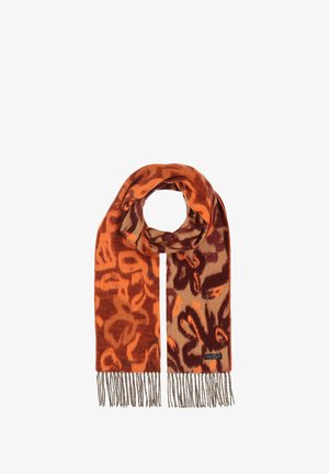 Bufanda de color naranja y marrón con un diseño estampado y flecos, hecha de material suave, que presenta un diseño abstracto en diversas tonalidades y una etiqueta de marca.