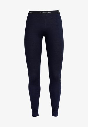 Navy leggings made of a soft material, featuring an elastic waistband with "icebreaker" logo. Fitted design with no visible seams.