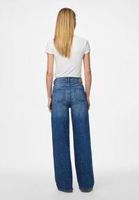 Pieces PCSILKE  - Wide leg - medium blue denim