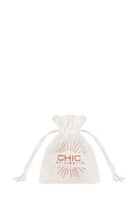 Cotton drawstring pouch in white with a metallic rose gold logo reading "CHIC BY LIRETTE," featuring a sunburst design around the text.