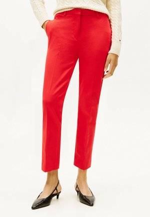 - Spodnie materiałowe