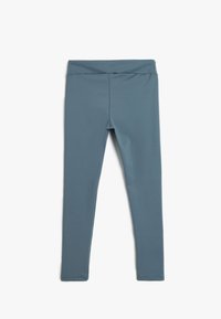 Leggings azules de tela elástica, con una cinturilla alta y un acabado liso y texturizado. Sin patrones ni acentos visibles.