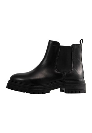 Bottines en cuir noir avec des panneaux élastiques sur les côtés, un bout arrondi et une semelle texturée robuste. Tirant à l'arrière pour un enfilage facile.