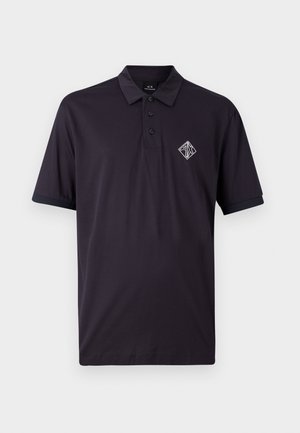 Dark navy polo shirt made of cotton with a collar, three-button placket, and short sleeves. Features a white embroidered logo on the chest.