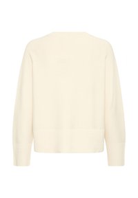 Grietos spalvos megztinis su laisvu siluetu, linkiu tekstūra ir ilgomis rankovėmis. Paprastas apykaklės dizainas ir trumpas ilgis, sukurtas be raštų ar puošmenų.