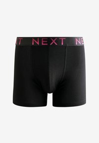 Boxeri negri dintr-un material moale, având un brâu elastic lat cu branding roz "NEXT". Croi ajustat, fără cusături vizibile.