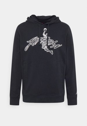 Sweat à capuche noir avec poche kangourou à l'avant, cordon de serrage à la capuche et illustration blanche d'un joueur de basket dunk avec l'inscription "Jordan" sur la poitrine.