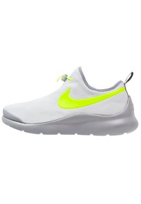 Light gray athletic slip-on shoe with neon yellow Nike swoosh, elastic toggle lacing, and a thick gray sole.