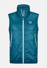 Blau gesteppte Weste mit hohem Kragen, Frontreißverschluss und kontrastierenden weißen und neon gelben Reißverschlüssen. Zwei seitliche Reißverschlusstaschen.