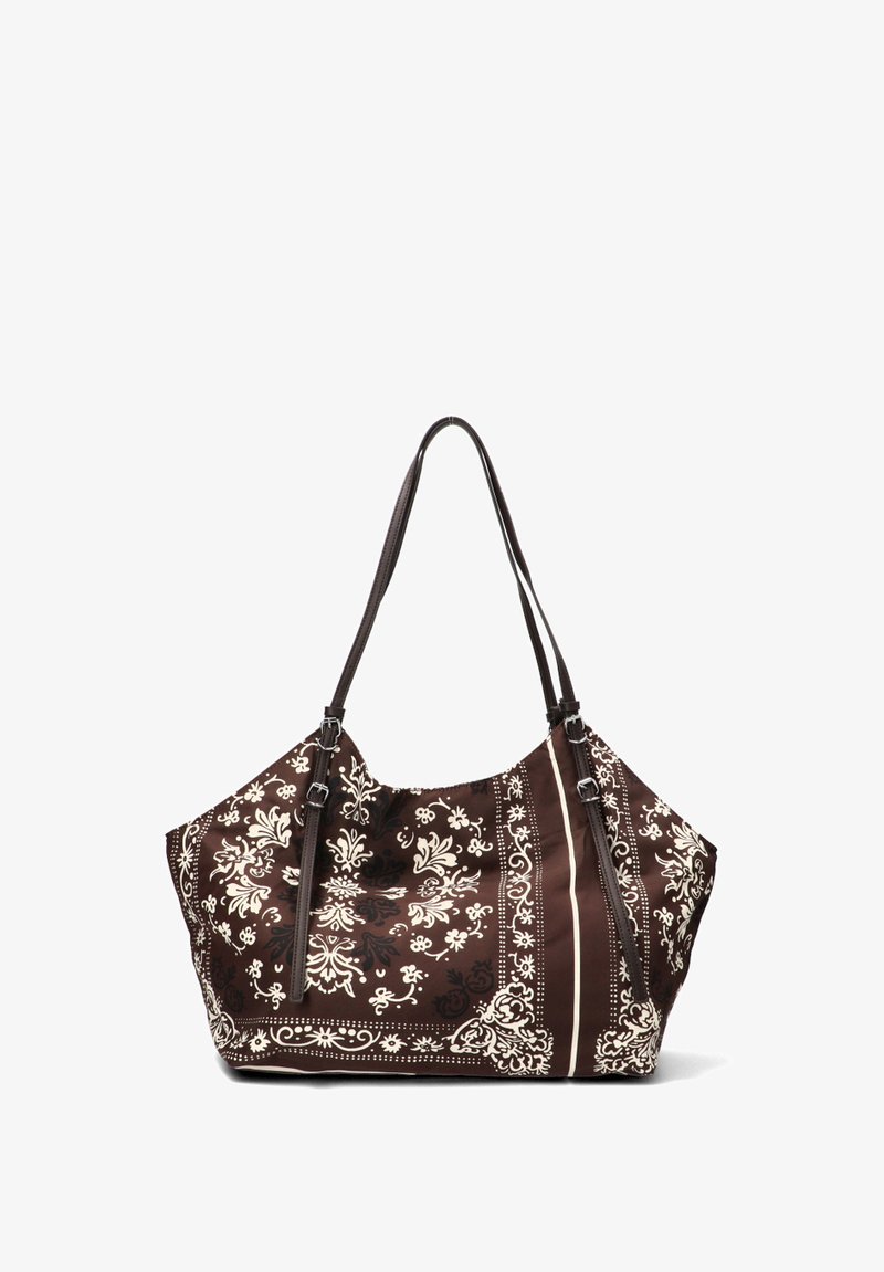 Bolso de mano marrón oscuro con patrones florales y geométricos en crema, dos asas resistentes y una textura de tela suave. Presenta cierres de cremallera y acentos.