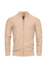 Suéter de punto beige con cremallera completa, con cuello, puños y dobladillo acanalados, mostrado sobre un fondo blanco.