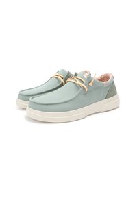 Light green canvas shoes with cream rubber soles, featuring an orange and white zig-zag patterned lining and beige laces.