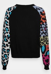 Black sweater featuring brightly patterned long sleeves with animal print and abstract designs in blue, pink, orange, and green.