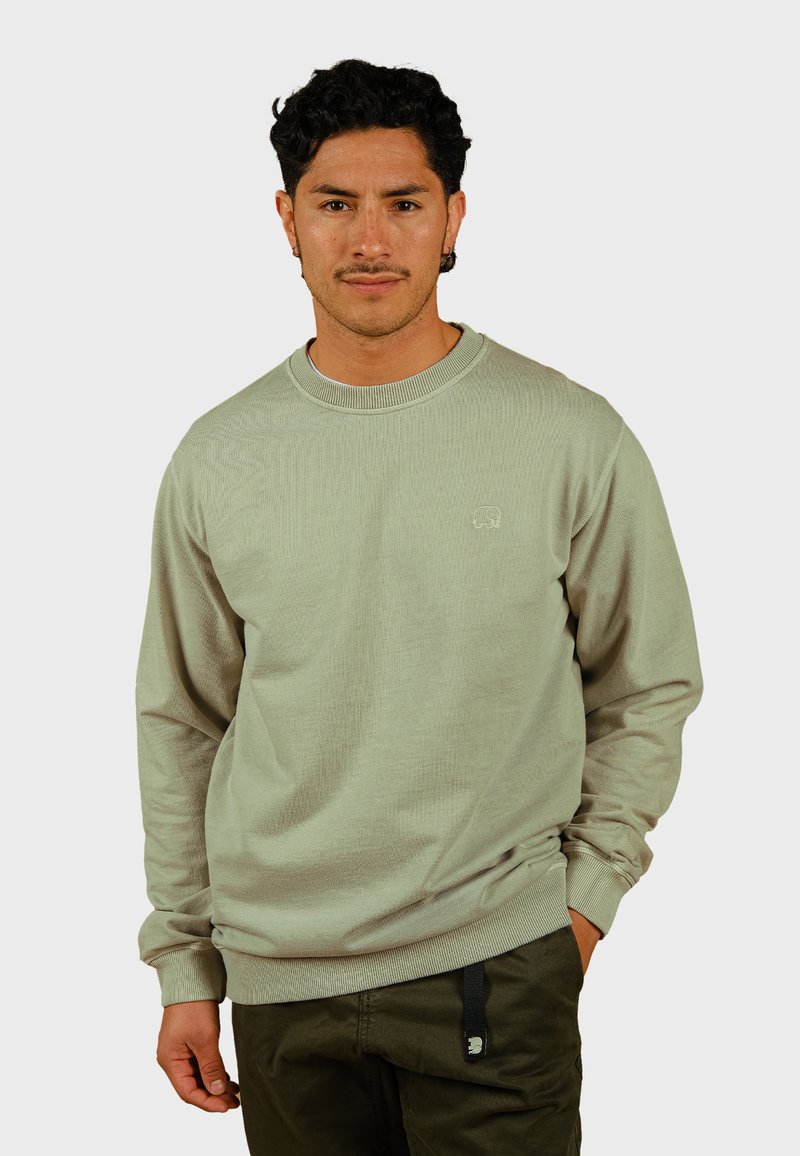 Lichtgroene, geribde sweatshirt met lange mouwen, ronde hals en geborduurd logo. Heeft een relaxte pasvorm en een gewafeld materiaal.
