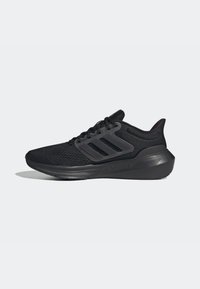 Zapatillas deportivas negras con parte superior de malla, tres franjas oscuras en el costado y una suela texturizada. Cuenta con un talón acolchado para mayor soporte.
