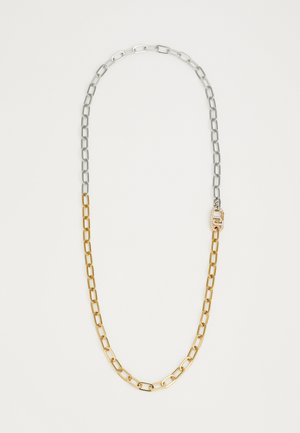 Zlatý a strieborný kovový reťazový náhrdelník s prepojenými článkami. Obsahuje ozdobnú sponu s kryštálmi. Hladký povrch, rôzne veľkosti článkov.