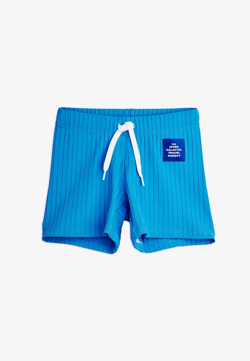 Shorts de bain bleus côtelés avec cordon blanc et un patch indiquant « The Inter Galactic Travel Agency » sur le devant côté droit.