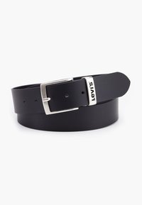 Black leather belt with a silver metal buckle. The buckle features a rectangular shape and engraved "Levi's" logo. Smooth texture and classic design.