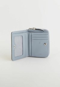 Compact RFID wallet in soft light blue leather, featuring a clear ID slot, multiple card slots, and a snap closure. Textured interior lining.