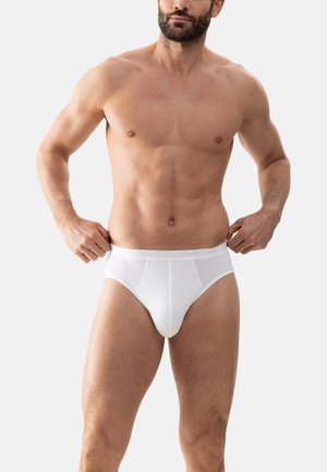 Mutande bianche in cotone con vestibilità aderente, dotate di una morbida fascia in vita con il nome del marchio in rilievo. Tessuto liscio e leggero con un design minimale.