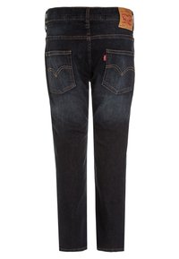 Tummansiniset farkut suoralla lahkeella, joissa on kaksi takataskua tikkausyksityiskohdilla sekä nahkainen merkkilaatta vyötäröllä.