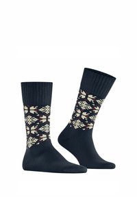 Gestrickte Socken in Dunkelblau mit einem gemusterten Design, das cremefarbene, rote und blaue Akzente aufweist. Gerippter Bund für zusätzlichen Komfort und Struktur.
