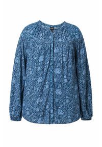 Blusa a fiori blu con scollatura rotonda, chiusura a bottoni sul davanti e maniche lunghe con polsini arricciati. Tessuto morbido.