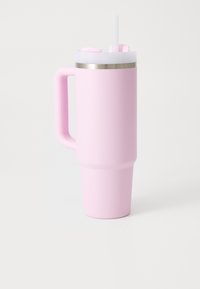 Pink insulated travel mug with a textured surface, stainless steel rim, a handle, and a lid featuring a straw opening.