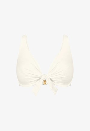 Haut de bikini blanc avec un nœud à l'avant et de larges bretelles, doté d'une petite boucle en or sous le nœud.