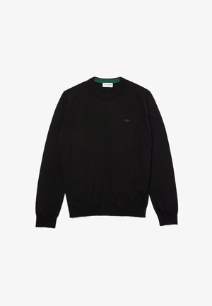 Maglione nero a girocollo realizzato in cotone, con polsini e orlo a coste, decorato con un piccolo logo Lacoste nero sul petto.