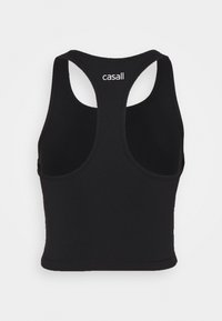Černý žebrovaný crop top s designem racerback a bílým logem "casall" umístěným na horní části zad.