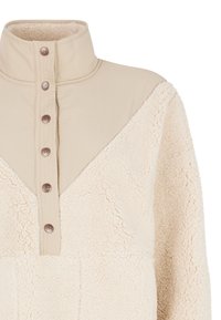 Beige fleece pullover met een hoge kraag, voorzien van een contrasterend paneel en een rij bruine knopen. Zachte, gestructureerde stof met een geometrisch ontwerp.