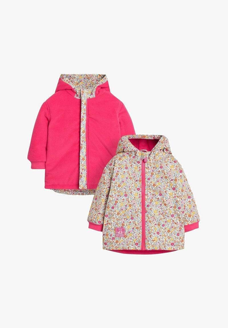 Ružová fleecová bunda s kvetinovou podšívkou a akcentami. Má kapucňu, predné zapínanie na zips a elastické manžety. Dvojvrstvový dizajn.