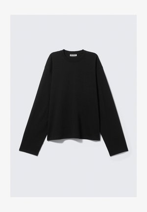 Svart langermet topp laget av myk stoff, med rund hals, avslappet passform og minimalistisk design uten synlige mønstre eller detaljer.