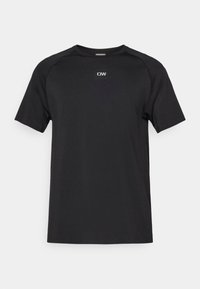 Μαύρο κοντομάνικο T-shirt από απαλό, ελαφρύ ύφασμα. Διαθέτει στρογγυλή λαιμόκοψη και μικρό λευκό λογότυπο στο στήθος.