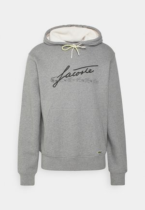 Szara bluza z kapturem, wykonana z mieszanki bawełny, z regulowanym kapturem, kieszenią kangurką, czarnym logo oraz małym zielonym emblematem krokodyla.