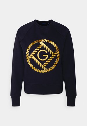 Marineblauer Sweatshirt mit langen Ärmeln, das in der Mitte einen goldbestickten Seilkreis und ein "G"-Logo auf der Brust zeigt.