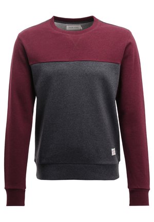 Genser med maroon øverste del og mørkegrå nederste del. Laget av myk stoff med ribbestrikkede mansjetter og kant. Lite logo-merke på fronten.