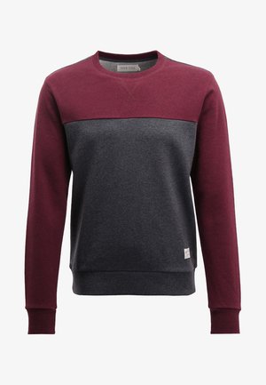 Bluza z maroon górną częścią i ciemnoszarym dolnym fragmentem. Wykonana z miękkiego materiału z żeberkowymi mankietami i dołem. Mała metka z logo z przodu.