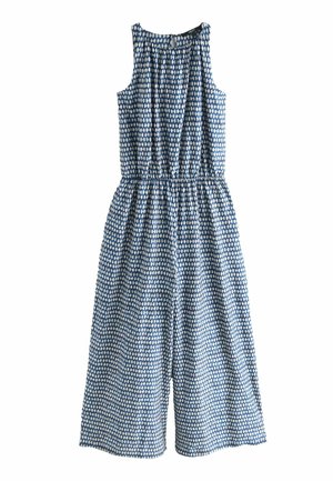Kék és fehér mintás overál ujjatlan designnal, rugalmas derékrésszel és kulcslyuk hát részletekkel. Könnyű anyag, széles lábakkal.